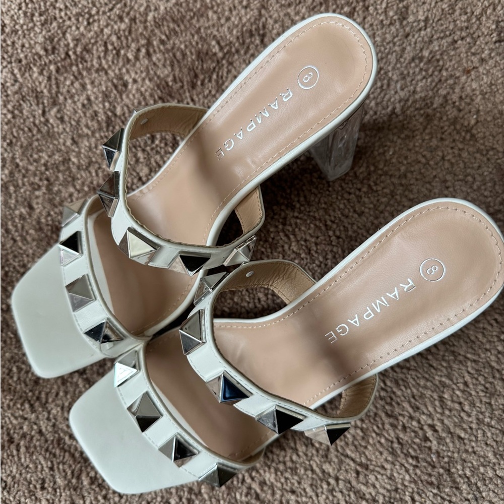 Brand New super cute heeled sandal with studs.